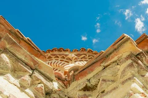 Historic stone structure under a clear blue sky shows intricate details of .. Stock Photos