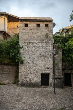 Historic Stone Tower and Cobblestone Street in Old Town Mostar Stock Photos