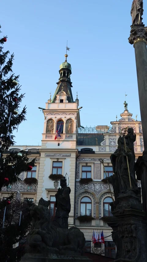 Historic tower and festive square captured in soft winter evening light Stock Footage 321650469