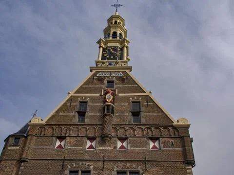 Historic tower with clockwork and detailed facade decoration, Hoorn, Netherlands Stock Photos