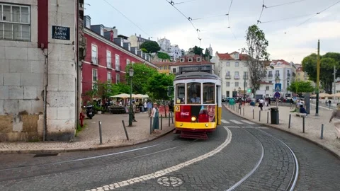 Historic tram number 28 In operation since 1873, in the city center of Lisbon Video stock 320149082