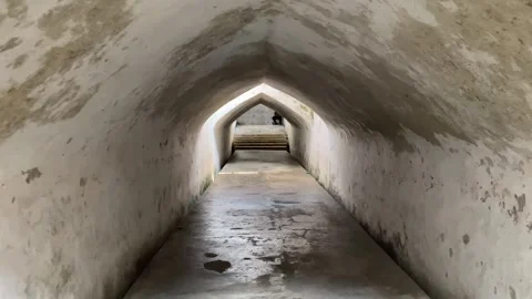 Historic vaulted stone passageway leading down a long tunnel. Stock Footage 344850957