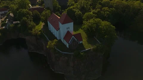 Historic Wehrkirche Beucha on cliff at sunset – aerial view near Leipzig Stock Footage 309963848