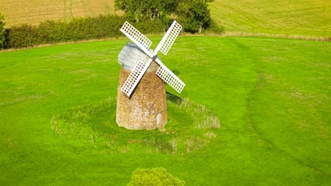 Historic wheat windmill and traditional flour mill. Old stone grain milling Stock Footage 346812260