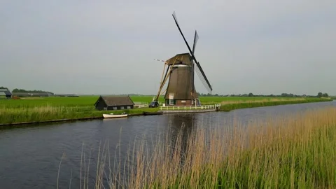 Historic wind mill at UNESCO world heritage site Kinderdijk in the Netherla.. Stock Footage 317359867