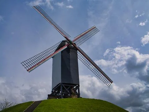 Historic Windmill Under Dramatic Belgian Sky Stock Photos