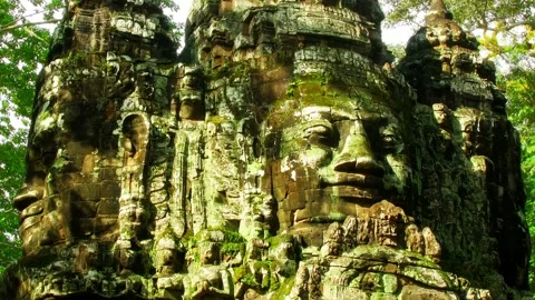 Historical Angkor faces in the shade of trees time lapse loop Stock Footage 153632132
