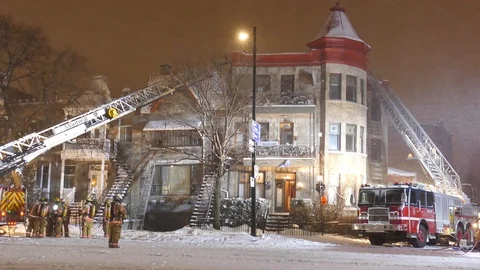 Historical buidling burning during snowfall at night Stock Footage 125419951