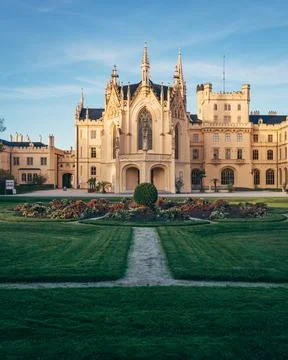 Historical castle surrounded by gardens in daytime Stock Photos