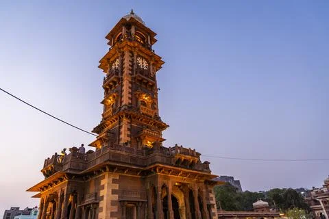 Historical clock tower ancient architecture with bright blue sky at sunset .. Foto stock