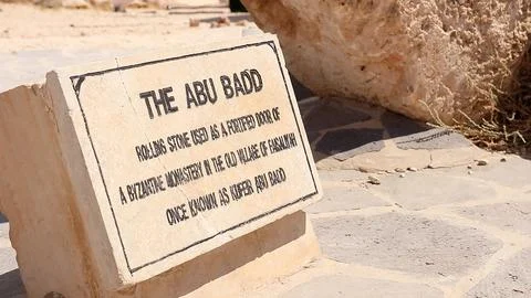 Historical information sign explaining The Abu Badd rolling stone 스톡 사진