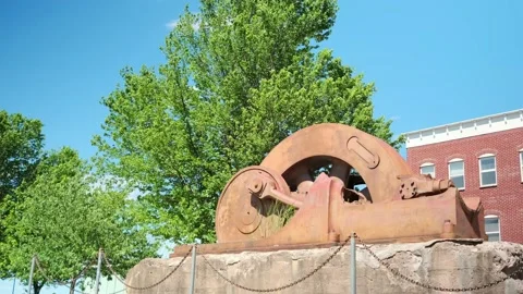 Historical monument of aged ship part / gear with blue sky - Piermont, NY. 4K Stock-Footage 133852325