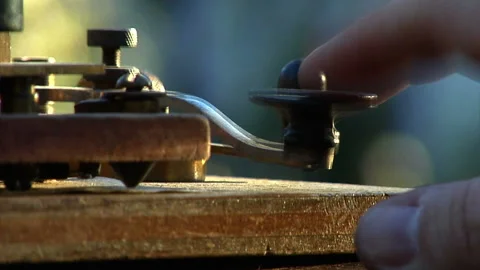 Historical old telegraph operator taps out message using morse code Stock Footage 148403693