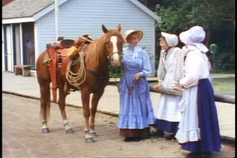 Historical Park, pioneer women in costumes with horse, old west Stock Footage