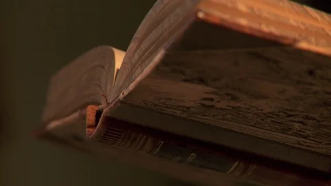 Historical Priest praying over old Bible Stock Footage 81222489