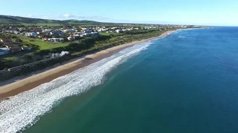 Historical railway vintage steam train aerial along coast Stock Footage 55921253