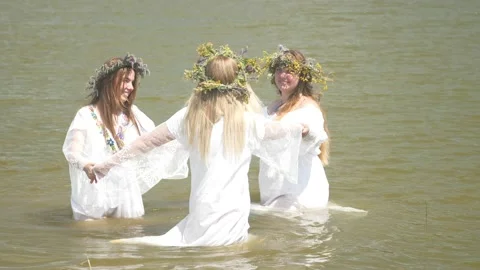 Historical reconstruction of the Feast of Ivan Kupala. Opening of the swimming Stock Footage 228388126