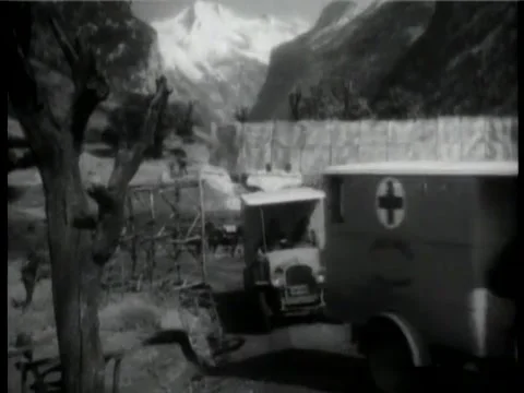 Historical reenactment of  World War I military ambulances leaving base, 1930s Video stock 58858809