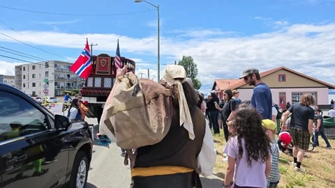 Historical reenactor with large canvas pack walking in street parade Stock Footage 339118924