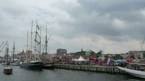 Historical sailing boats and schooner sailing along the Rostock Harbor 스톡 동영상 67575341