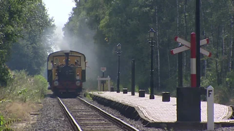 Historical steam train entering platform - on camera Stock Footage 32163432