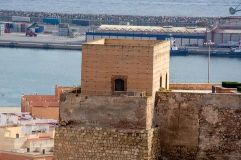 Historical stone structure overlooking harbor Stock Photos