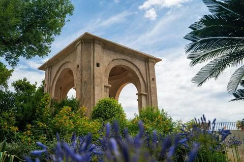 Historical Stone Structure Surrounded by Lush Greenery Stock Photos