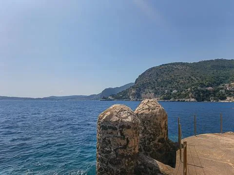Historical stone structures on coastal rocks in Cap d'Ail Photos