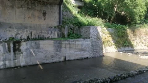 History Ink in the River Flowing Under the Bridge" Stock Footage 249955350