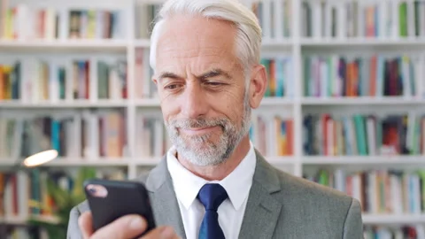 History, phone and scroll with man in library for archives, book collection or Stock Footage 336296562