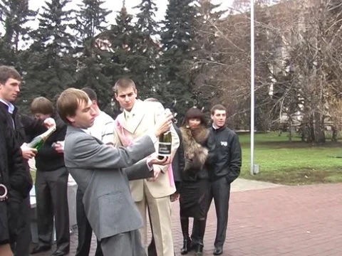 Hit the head with a cork from a bottle of champagne Stock Footage 83925904