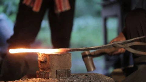 Hit a steel sword by antique process in steel plant. Thailand. Video stock 94265792