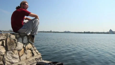  The hitchhiker sat down to rest by the river Stock Footage 158012284