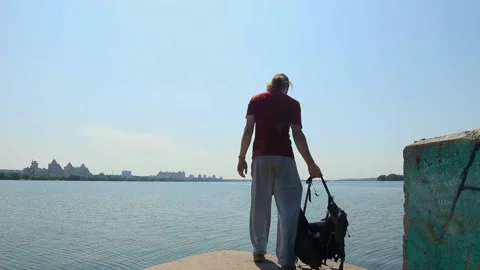 The hitchhiker sat down to rest by the river Stock Footage 158012291