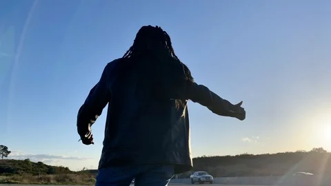 Hitchhiking for a ride Stock Footage 126040532