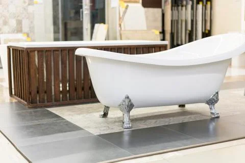 Hite bath in the building store. baths in the plumbing store. Sanitary engine Stock Photos