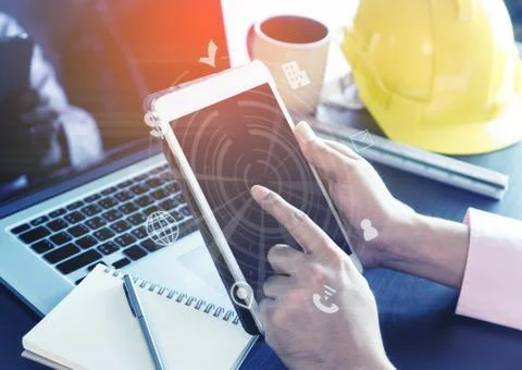 Hitech Engineer is working with innovation in tablet Stock Photos