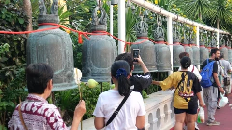 Hitting bells in Buddhist temple Stock Footage 295955691