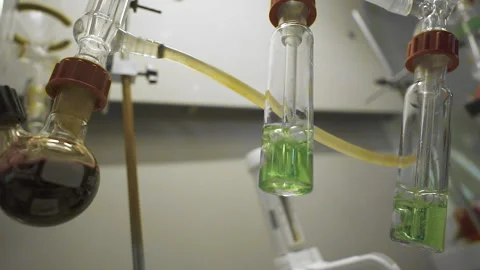 Hitting the camera (Dolly Zoom), close-up of test tubes boiling on fire Stock Footage 153863452