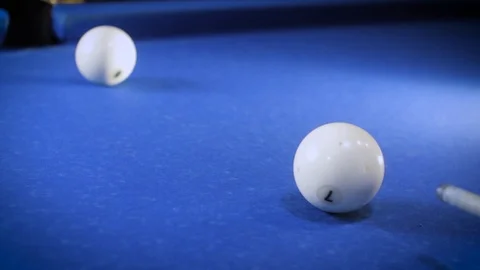Hitting the cue ball number 7 on a blue billiard ball. The billiard ball hits Stock Footage 89152806