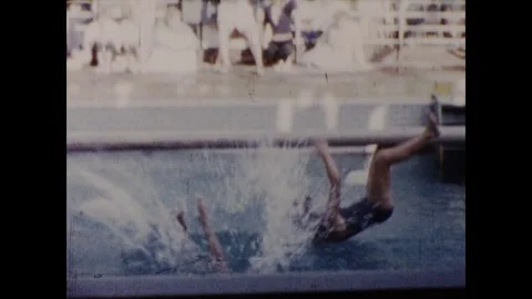 Hitting each other with a cushion over a pool Stock Footage 251820646
