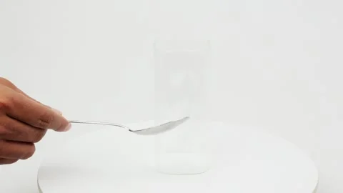 Hitting Glass with Spoon Creating Clear Sound Video stock 327847929