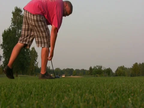 Hitting golf ball Stock Footage 34569121