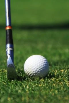 Hitting a golf ball Stock Photos