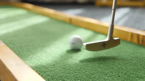 Hitting a Golf Ball with a Stick Video stock 111879923