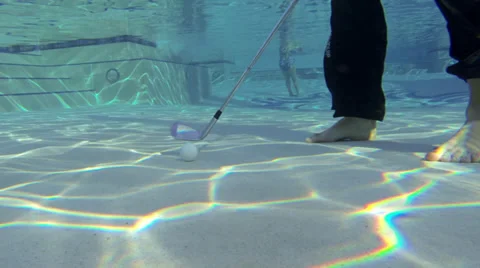Hitting golf ball underwater Stock Footage 39861896