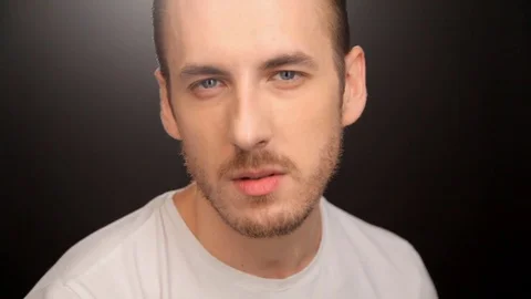 Hitting on the man's face on a dark background Stock Footage 80653784