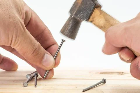 Hitting a nail Stock Photos
