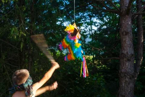 Hitting a pinata Stock Photos