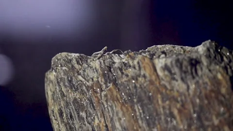 Hitting the raw stone with a hammer in slow motion Stock Footage 146962396